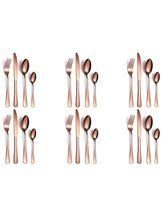 Rose gold stainless steel cutlery set arranged in multiple place settings