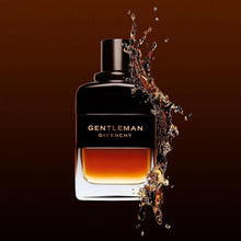 Eau de parfum bottle with black cap and amber liquid with dynamic splash effect