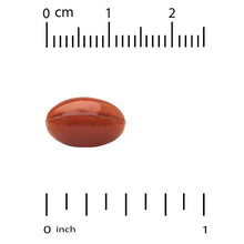 Marigold-colored softgel capsule shown with measurement rulers