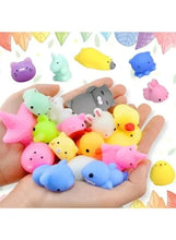Handful of pastel squishy animal toys with different faces and ears