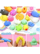 Assorted squishy animal toys with hands stretching and pressing
