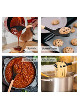 Assorted black silicone cooking utensils with wooden handles for cooking and serving