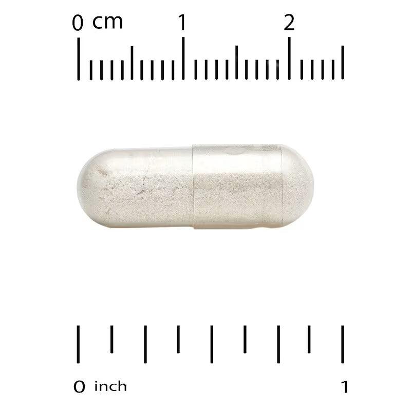 White capsule on scale, showing L-cysteine size in cm and inches