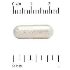 White capsule on scale, showing L-cysteine size in cm and inches