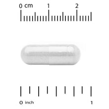 L-glutamine capsule close-up with measurement scale, 1 inch