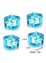Blue ice-cube squishy toy with white snowflake pattern, cube shape