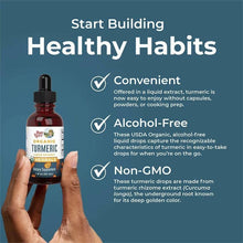 MaryRuth's organic turmeric liquid extract bottle held in hands, alcohol-free