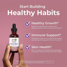 MaryRuth's infant multivitamin organic liquid drops bottle held in hands