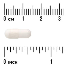 Off-white boron supplement capsule next to 0–1 inch measurement scale