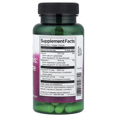 Swanson supplement facts label on bottle with dark cap and visible green veggie caps