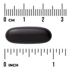 Dark oil softgel capsule, oval shape with inch measurement scale
