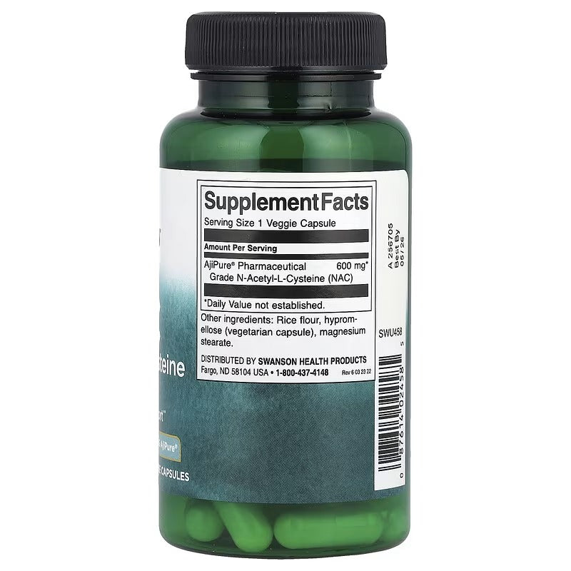 Swanson NAC supplement facts label on green bottle with vegan capsules visible
