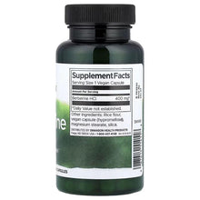 Berberine supplement facts label on dark green plastic bottle with black cap