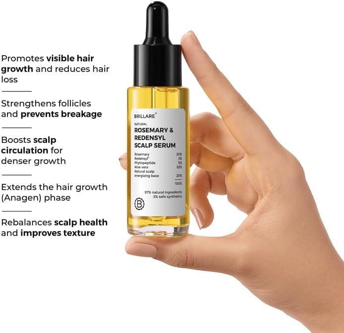 Rosemary and Redensyl scalp serum held in hand; black dropper, golden bottle