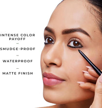 Black kajal pencil with matte liner on closed eyelid, applied near lash line