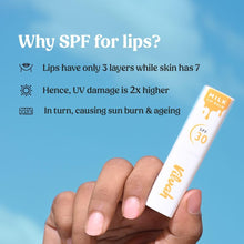 SPF 30 non-tinted lip balm tube held in hand