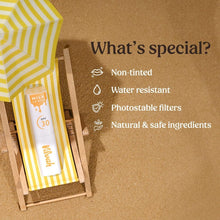 Non-tinted SPF 30 lip balm tube in yellow striped box