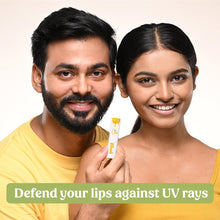 SPF 30 non-tinted lip balm tube held up in hand
