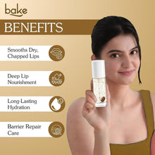 BAKE lip oil bottle held by model with smooth, glossy lip finish