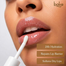 BAKE lip oil applicator wand applying glossy balm on pink lips