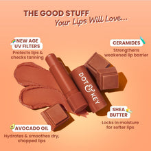 Cocoa nude tinted SPF 50 lip balm bullet with brown swatch and lip balm pieces