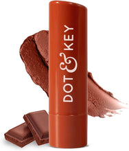 Cocoa nude tinted SPF 50 lip balm tube with lip swatch and chocolate-colored balm pieces