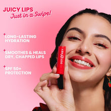 Red tinted SPF 50 lip balm held near smiling lips