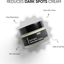 Dark spot reduction cream jar with black lid, shown at an angle with label