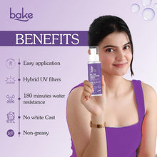 De-tan sunscreen spray bottle held by a woman, purple label and white pump