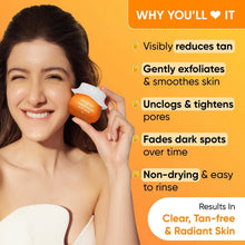 Dot & Key Mango Detan clay mask jar held for application, orange 70 g.