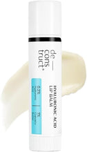 White lip balm tube with black band and blue label; pale balm smear visible