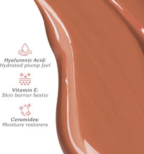 Mocha liquid lipstick swatch with glossy brown liquid texture