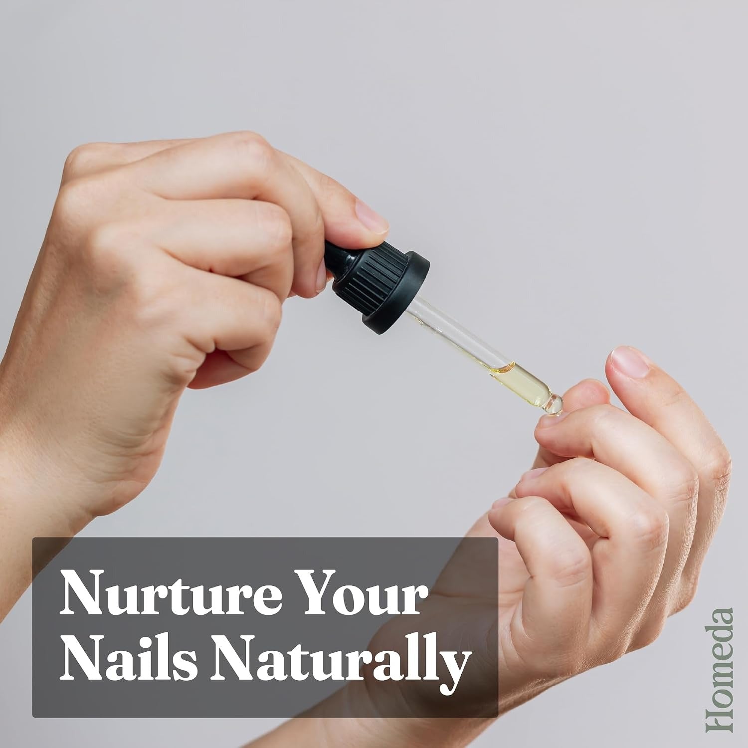 Cold-pressed castor oil dropper applying oil for natural nail care.