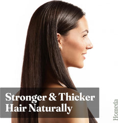 Castor oil hair care on long dark hair, side profile of a woman.