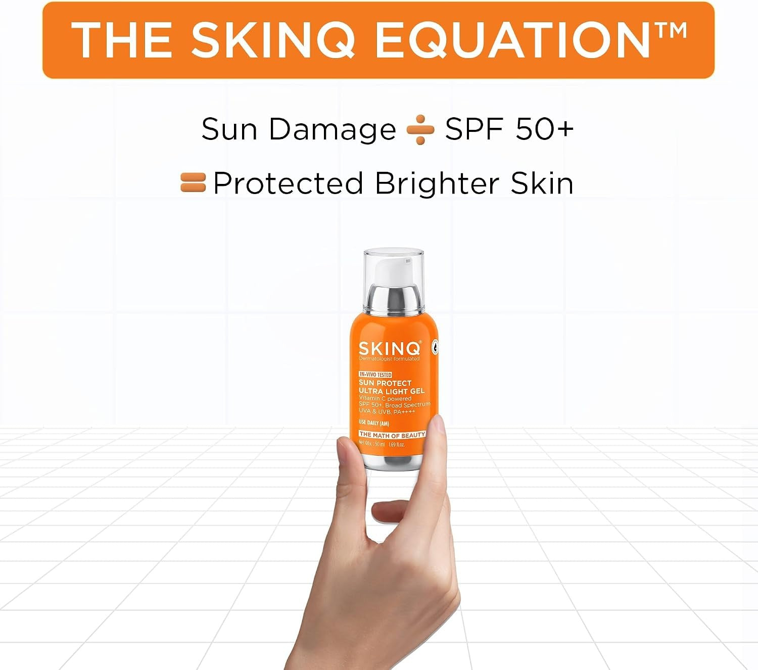 SkinQ sunscreen SPF 40 PA++++ bottle in orange label and clear cap, held in a hand