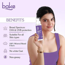 bake Blueberry Kisses sunscreen bottle with pump held by model, purple label, SPF 70 PA++++