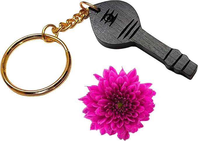 Wooden vel keychain with black carved face, gold chain links and key ring