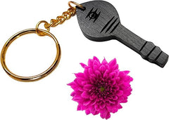 Wooden vel keychain with black carved face, gold chain links and key ring