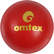 Red Omtex cricket practice ball with large yellow omtex logo and stitched edge