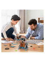 Solar-powered building robot kit with kid models, parts on tabletop during assembly
