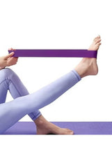Purple TPE resistance band held in hands for leg stretch