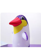 Inflatable penguin tumbler boxing toy with purple head and orange beak