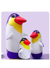 Inflatable penguin boxing toy trio, large purple-white penguin with two smaller penguins