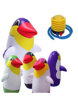 Inflatable penguin boxing toy with purple, white, and yellow body and blue pump hose