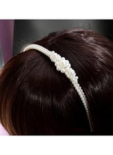 White pearl beaded headband with clustered pearls, worn on hair