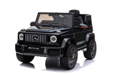 Kids electric ride-on car in black with grille and round headlights, front 3/4 view