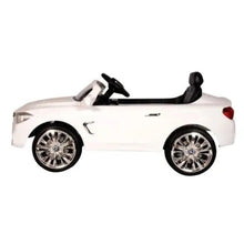 White kids electric ride-on car with black seats, side profile, chrome wheels.