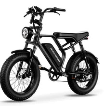 Black electric fat-tire bike with front headlight and front suspension fork