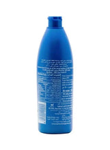 Coconut oil bottle back view, blue with ingredients text and barcode