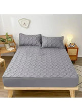 Quilted dark grey fitted bedding topper set with two matching pillows